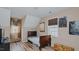 Bedroom featuring slanted ceilings, wood floors, and two windows at 802 N Fifth St, Mebane, NC 27302