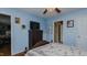 Bedroom with blue walls and wood-look floors featuring classic wood dresser with TV on top at 802 N Fifth St, Mebane, NC 27302