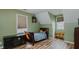 Bedroom with wood floors, twin bed, and lots of natural light at 802 N Fifth St, Mebane, NC 27302