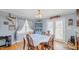 Charming dining area featuring hardwood floors, natural light, and access to outdoor deck at 802 N Fifth St, Mebane, NC 27302