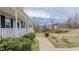 Well-kept front yard with landscaped walkway and established bushes, enhancing curb appeal at 802 N Fifth St, Mebane, NC 27302