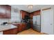 Charming kitchen with stainless steel appliances, dark wood cabinets, and lots of natural light at 802 N Fifth St, Mebane, NC 27302