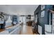 Open-concept living space with a comfortable gray sectional sofa, dining area, and hardwood floors at 802 N Fifth St, Mebane, NC 27302