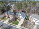 An aerial shot displays the home nestled among mature trees in a desirable neighborhood at 803 Landuff Ct, Cary, NC 27519