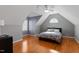 Bedroom with slanted ceilings, hardwood floors, and natural light at 803 Landuff Ct, Cary, NC 27519