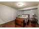 Bedroom with hardwood floors, a queen bed and a decorative storage trunk, offering a cozy retreat at 803 Landuff Ct, Cary, NC 27519