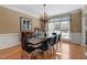Elegant dining room with a chandelier and hardwood floors at 803 Landuff Ct, Cary, NC 27519