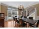 Formal dining area with hardwood floors and large windows at 803 Landuff Ct, Cary, NC 27519