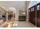 Welcoming foyer featuring tile flooring and an arched doorway at 803 Landuff Ct, Cary, NC 27519