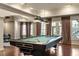 Game room featuring a well-lit billiard table and access to the outdoors at 803 Landuff Ct, Cary, NC 27519