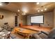 Comfortable home theater room with large screen, comfortable seating, and recessed lighting at 803 Landuff Ct, Cary, NC 27519