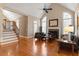 Open-concept living area features a fireplace, hardwood floors, and ample natural light at 803 Landuff Ct, Cary, NC 27519