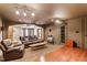 Inviting living room with hardwood floors, a stone fireplace, and comfortable seating at 803 Landuff Ct, Cary, NC 27519