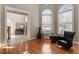 Elegant living room featuring hardwood floors, large windows, and stylish architectural details at 803 Landuff Ct, Cary, NC 27519