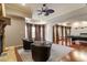 Open living space featuring hardwood floors, large windows, and a billiards table, ideal for entertaining guests at 803 Landuff Ct, Cary, NC 27519