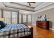 Bright main bedroom with large windows, hardwood floors, and elegant dresser at 803 Landuff Ct, Cary, NC 27519