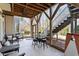 View of a covered patio featuring a ceiling fan, comfortable seating, and stairs to the back yard at 803 Landuff Ct, Cary, NC 27519