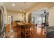 Open recreation space with a kitchen area, dining table, and home gym equipment, perfect for active living and entertainment at 803 Landuff Ct, Cary, NC 27519