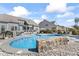 A beautiful in-ground pool features a stone waterfall and a lovely patio area for entertaining friends and Gathering at 929 Mountain Vista Ln, Cary, NC 27519