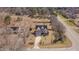 Aerial view of two-story home with driveway and a well-maintained lawn at 100 Watkins Farm Rd, Rolesville, NC 27571