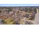High angle drone view of the home and neighborhood with mature trees at 100 Watkins Farm Rd, Rolesville, NC 27571