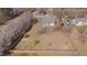 Aerial view of backyard with a spacious yard and wood fence at 100 Watkins Farm Rd, Rolesville, NC 27571