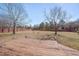 View of backyard, patio, trees and treed perimeter at 100 Watkins Farm Rd, Rolesville, NC 27571