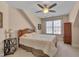 Cozy bedroom with a ceiling fan and a window that offers natural light at 100 Watkins Farm Rd, Rolesville, NC 27571