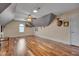 Large bonus room featuring hardwood floors, ceiling fan and a window seat at 100 Watkins Farm Rd, Rolesville, NC 27571
