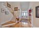 Bright foyer with hardwood floors, a staircase with white railings, and a view of the front door at 100 Watkins Farm Rd, Rolesville, NC 27571