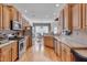 Well-appointed kitchen featuring stainless steel appliances, granite countertops, and ample cabinet space at 100 Watkins Farm Rd, Rolesville, NC 27571