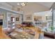 Bright and airy living room showcasing the open floor plan and seamless flow to other rooms at 100 Watkins Farm Rd, Rolesville, NC 27571
