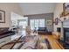 Cozy living room featuring a fireplace, comfortable seating, and an open view to the dining area at 100 Watkins Farm Rd, Rolesville, NC 27571
