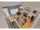 Aerial view of a living room showcasing a fireplace, fan, high ceilings and lots of furniture at 100 Watkins Farm Rd, Rolesville, NC 27571