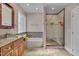 The main bath features a large soaking tub, glass shower and a spacious vanity area at 100 Watkins Farm Rd, Rolesville, NC 27571