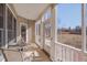 Screened porch with table and chairs, and views of the backyard at 100 Watkins Farm Rd, Rolesville, NC 27571