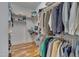 This walk-in closet is well-organized with multiple rods and shelving units to maximize storage space at 100 Watkins Farm Rd, Rolesville, NC 27571
