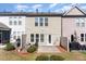 View of the backyard showing the patio, and the exterior of the home's neutral siding at 1009 Laceflower Dr, Durham, NC 27713
