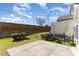 Backyard with a privacy fence, small shrubs, and an outdoor bench at 1009 Laceflower Dr, Durham, NC 27713