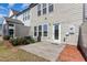 Private backyard area featuring a concrete patio perfect for outdoor relaxation and entertaining at 1009 Laceflower Dr, Durham, NC 27713