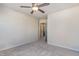 Bedroom with carpet, ceiling fan and an open doorway to another room at 1009 Laceflower Dr, Durham, NC 27713