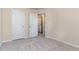 Bedroom featuring access to the laundry room and carpeted floors at 1009 Laceflower Dr, Durham, NC 27713