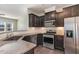 Well-appointed kitchen featuring stainless steel appliances and granite countertops at 1009 Laceflower Dr, Durham, NC 27713