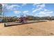Community playground with slides and swings offers a great outdoor play area at 1009 Laceflower Dr, Durham, NC 27713