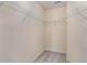 Walk-in closet with neutral colored carpet, white trim, and wire shelving at 1009 Laceflower Dr, Durham, NC 27713