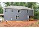 Exterior view of the home features a neutral color and multiple windows offering an abundance of natural light at 105 Sherwood Ln, Hillsborough, NC 27278