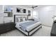 This bedroom features large windows for natural light, neutral decor, and stylish contemporary furniture at 105 Sherwood Ln, Hillsborough, NC 27278