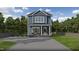 Charming two-story home with a welcoming front porch and a spacious driveway at 105 Sherwood Ln, Hillsborough, NC 27278