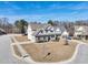 An aerial view of a home on a large lot with well-maintained landscaping and a long driveway at 109 Hammermill Dr, Fuquay Varina, NC 27526