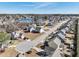 An elevated view showcases a neighborhood with sidewalks, a pond, and houses with mature trees at 109 Hammermill Dr, Fuquay Varina, NC 27526